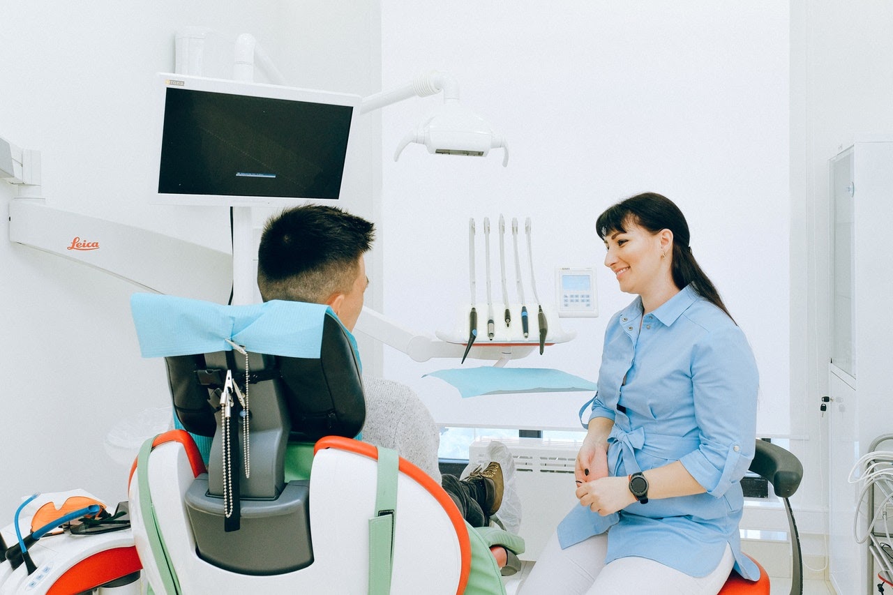 dentist talking to patient