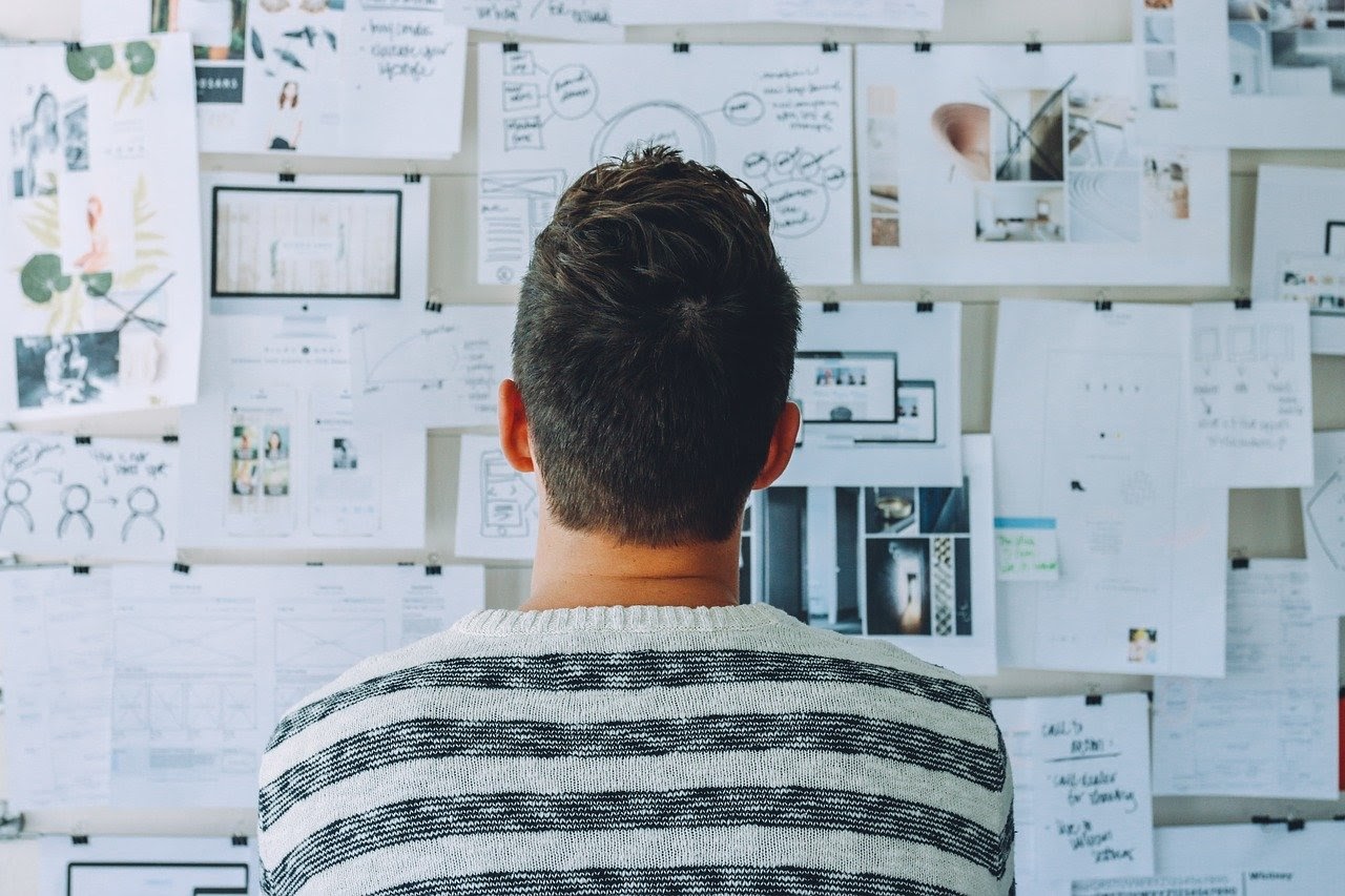 man analysing data on wall