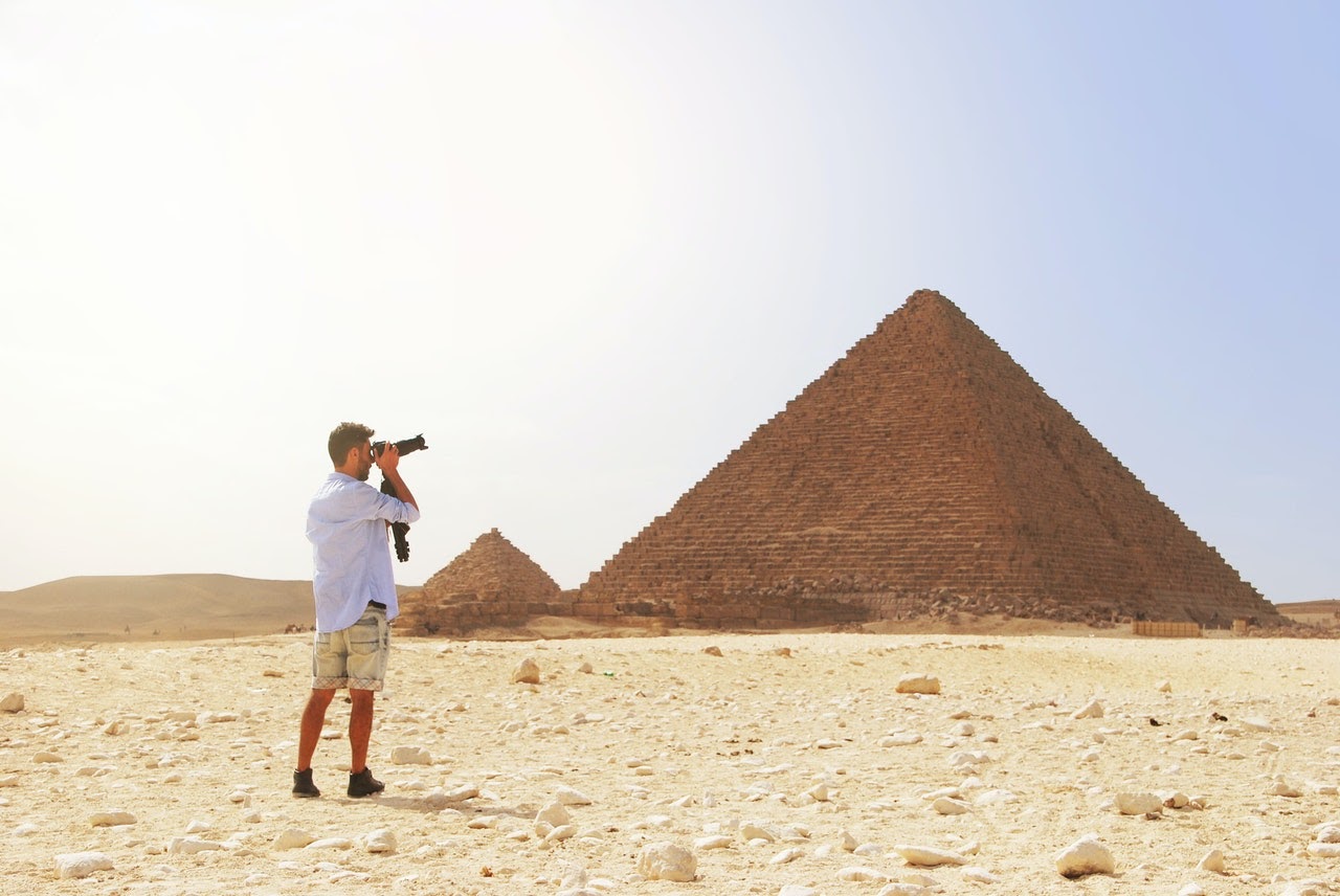 Man taking photo of Pyramid