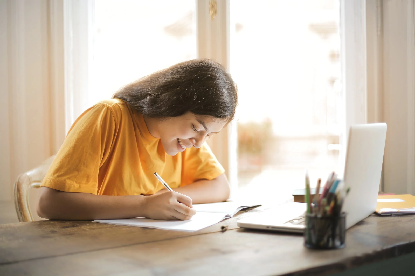 student working in front of laptop