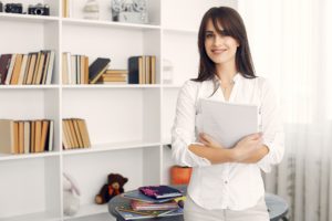 tutor holding notebook