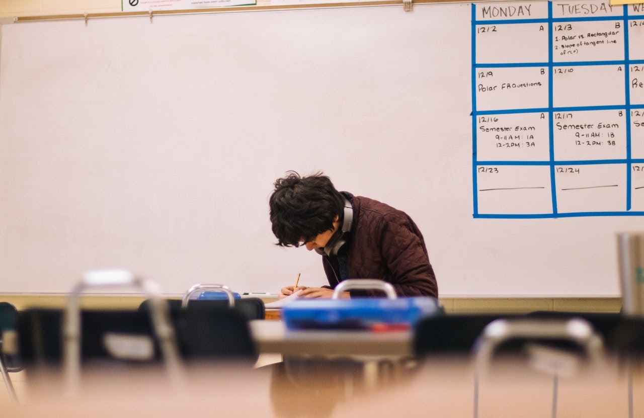 young man taking exam