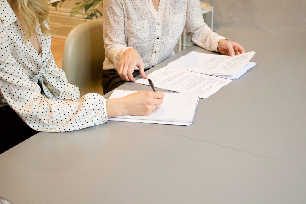 Two women looking over papers