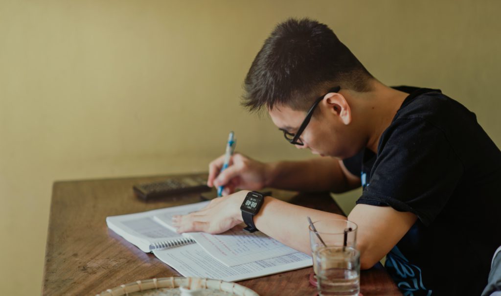 student working from book