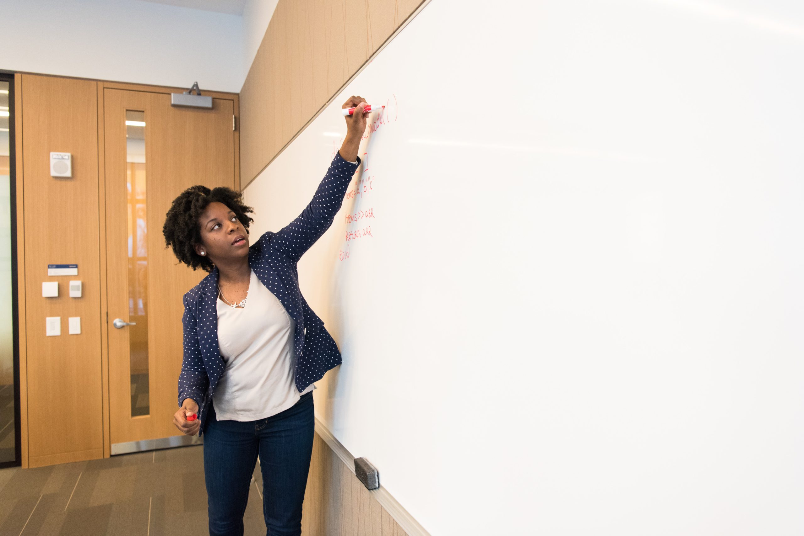 teacher writing on board