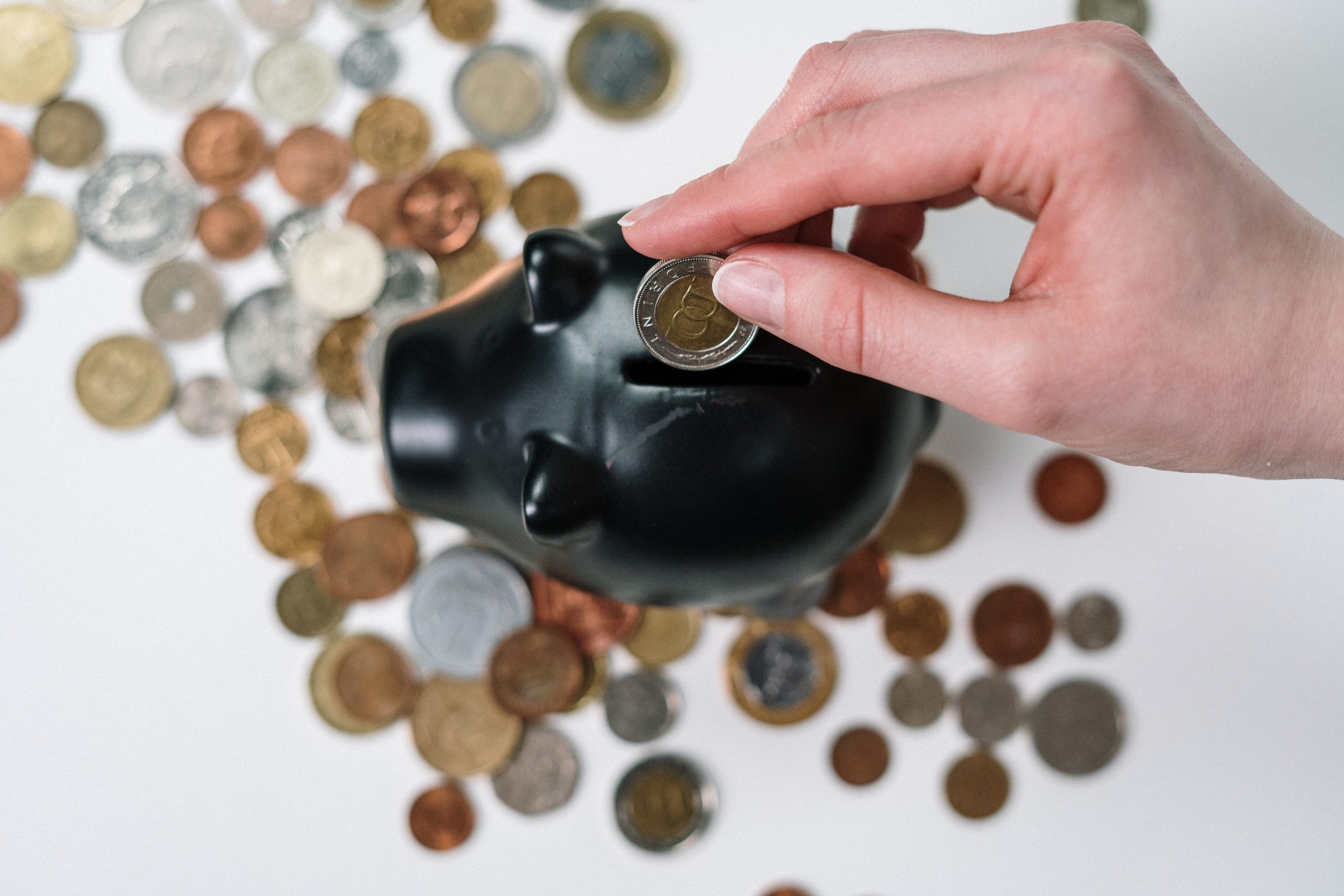 piggy bank with person saving money