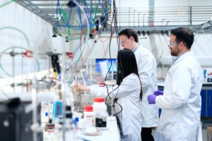 Three scientists in laboratory 