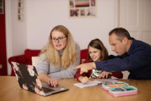 Parents helping student to study online