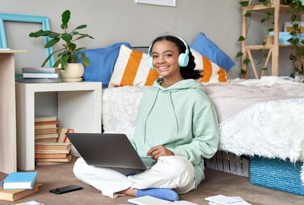 Student studying at home in her bedroom