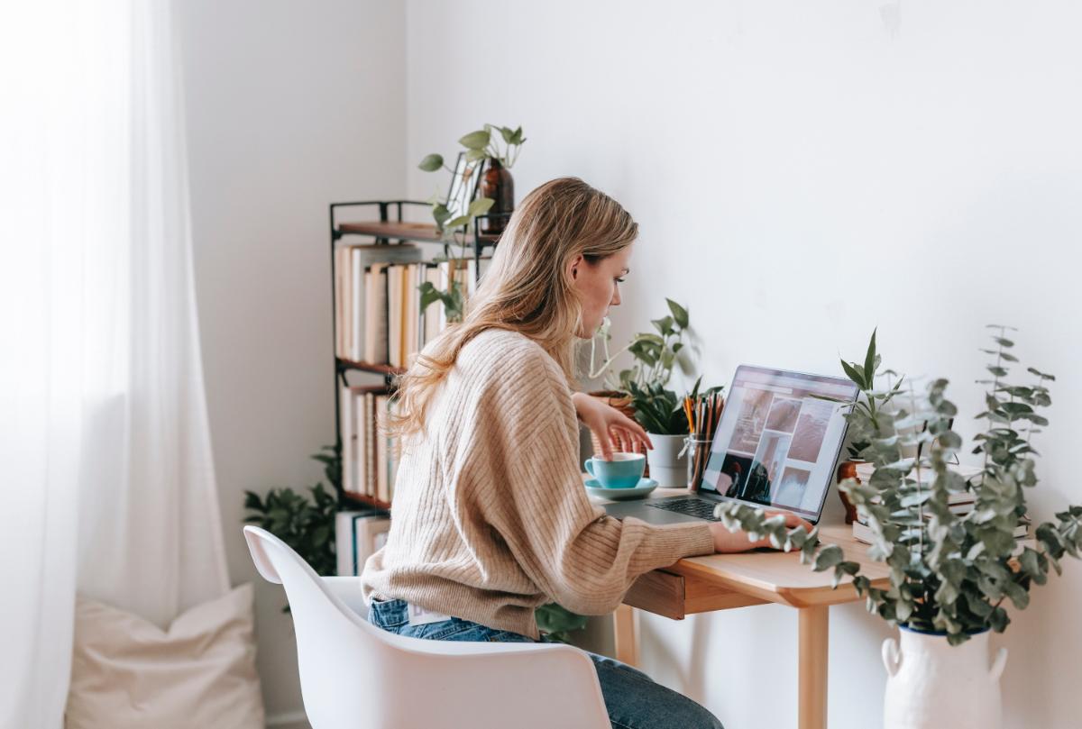 Student working from her bedroom on laptop