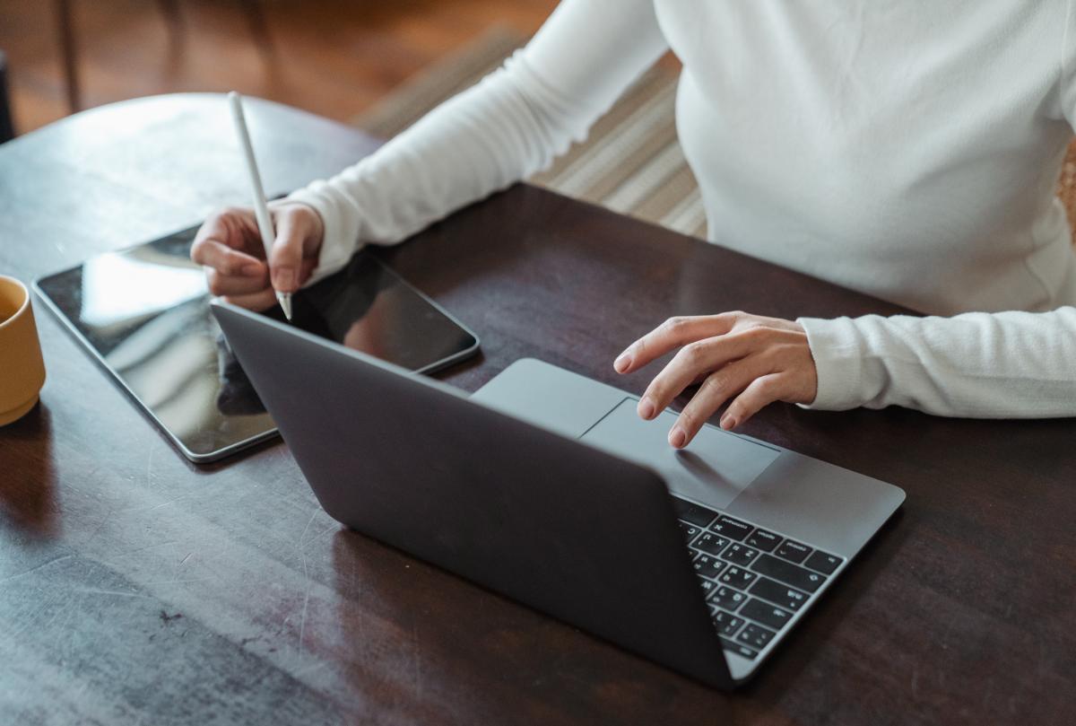 An online tutor taking notes at home