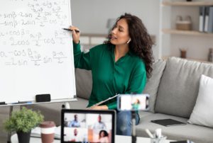 Online maths tutor teaching a class