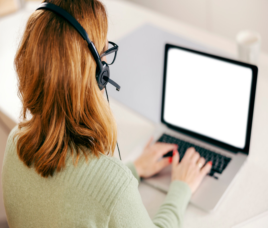 Online tutor working on a laptop